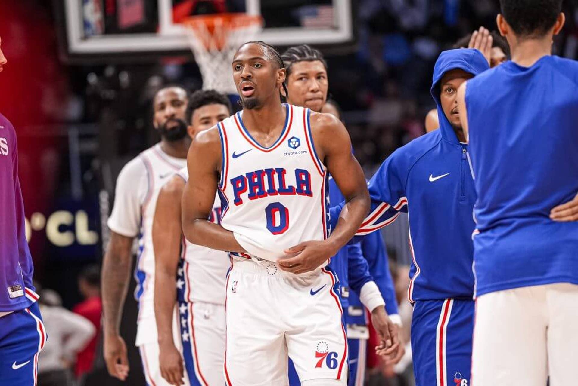 Philadelphia 76ers guard Tyrese Maxey (center) walks while holding his right hand after being injured against the Atlanta Hawks.