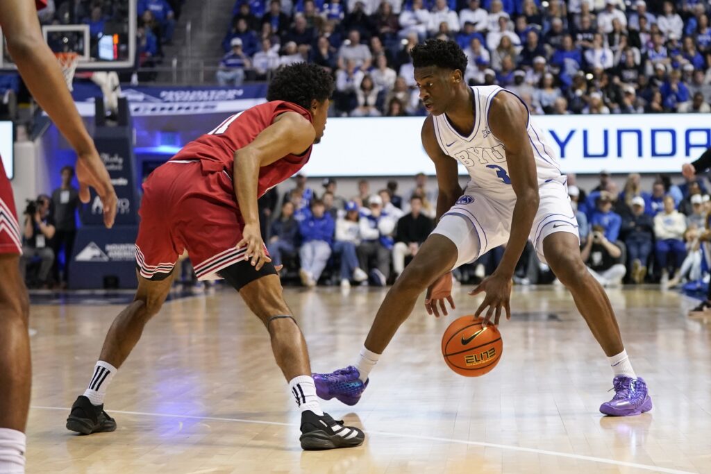 BYU Cougars forward AJ Dybantsa (3) dribbles the ball while being defended by Texas Tech Red Raiders guard Jaylen Petty (11) during the first half at Marriott Center.