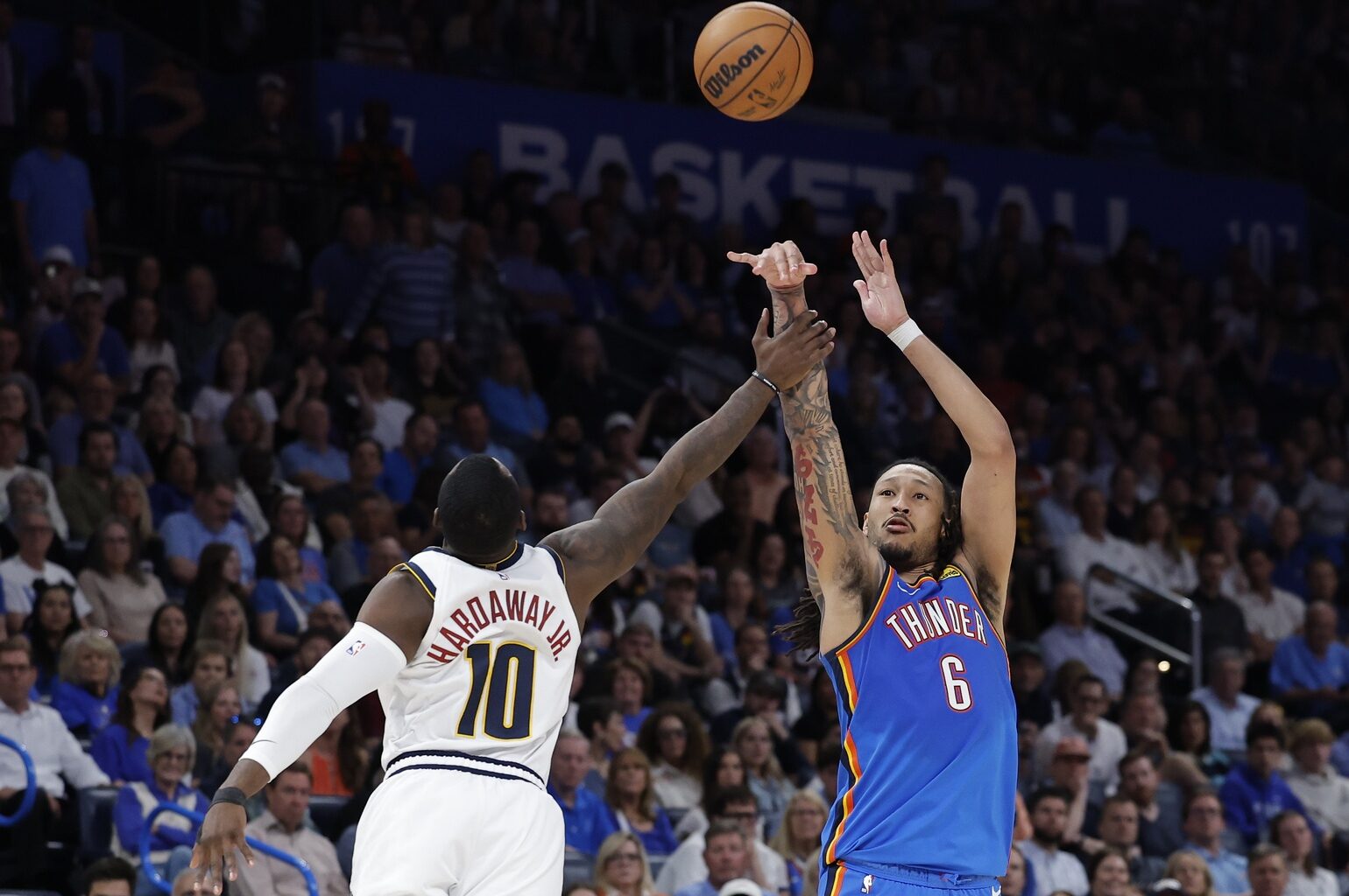 Mar 9, 2026; Oklahoma City, Oklahoma, USA; Oklahoma City Thunder forward Jaylin Williams (6) is fouled by Denver Nuggets guard/forward Tim Hardaway Jr. (10) as he shoots during the second half at Paycom Center. Mandatory Credit: Alonzo Adams-Imagn Images
