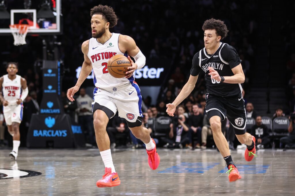 Mar 10, 2026; Brooklyn, New York, USA; Detroit Pistons guard Cade Cunningham (2) drives past Brooklyn Nets guard Nolan Traore (88) in the third quarter at Barclays Center. Mandatory Credit: Wendell Cruz-Imagn Images