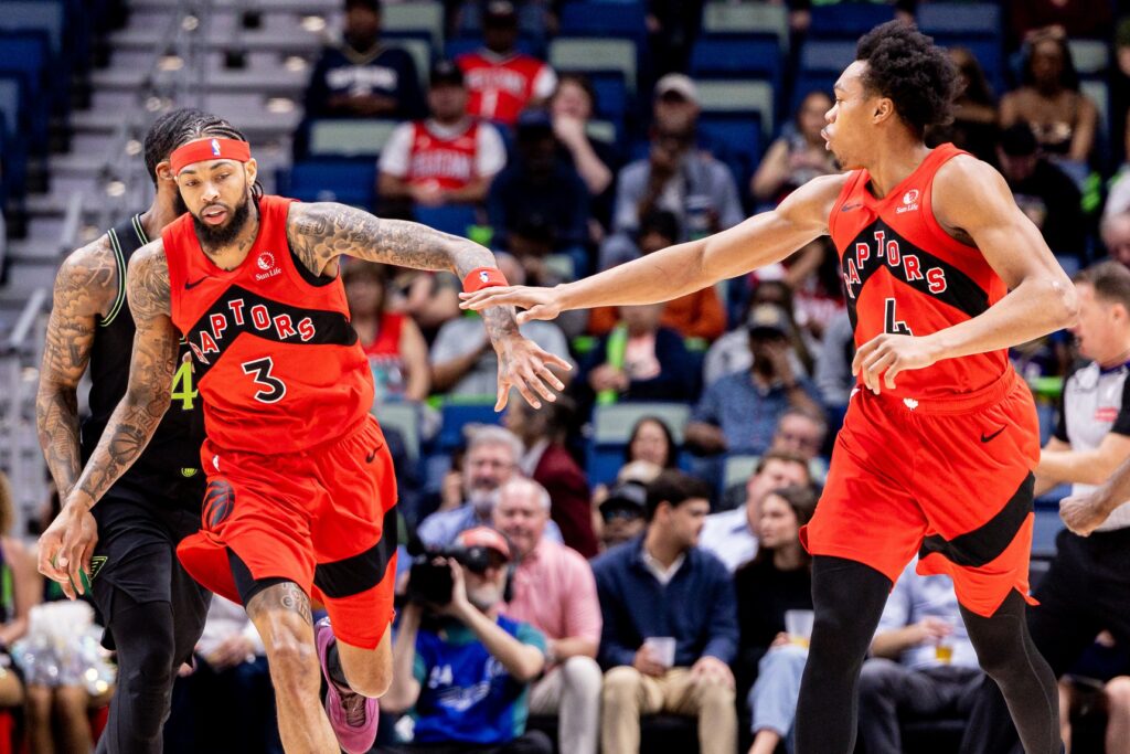Mar 11, 2026; New Orleans, Louisiana, USA; Toronto Raptors forward/guard Scottie Barnes (4) and forward Brandon Ingram (3) slap hands after a play against the New Orleans Pelicans during the first half at Smoothie King Center. Mandatory Credit: Stephen Lew-Imagn Images