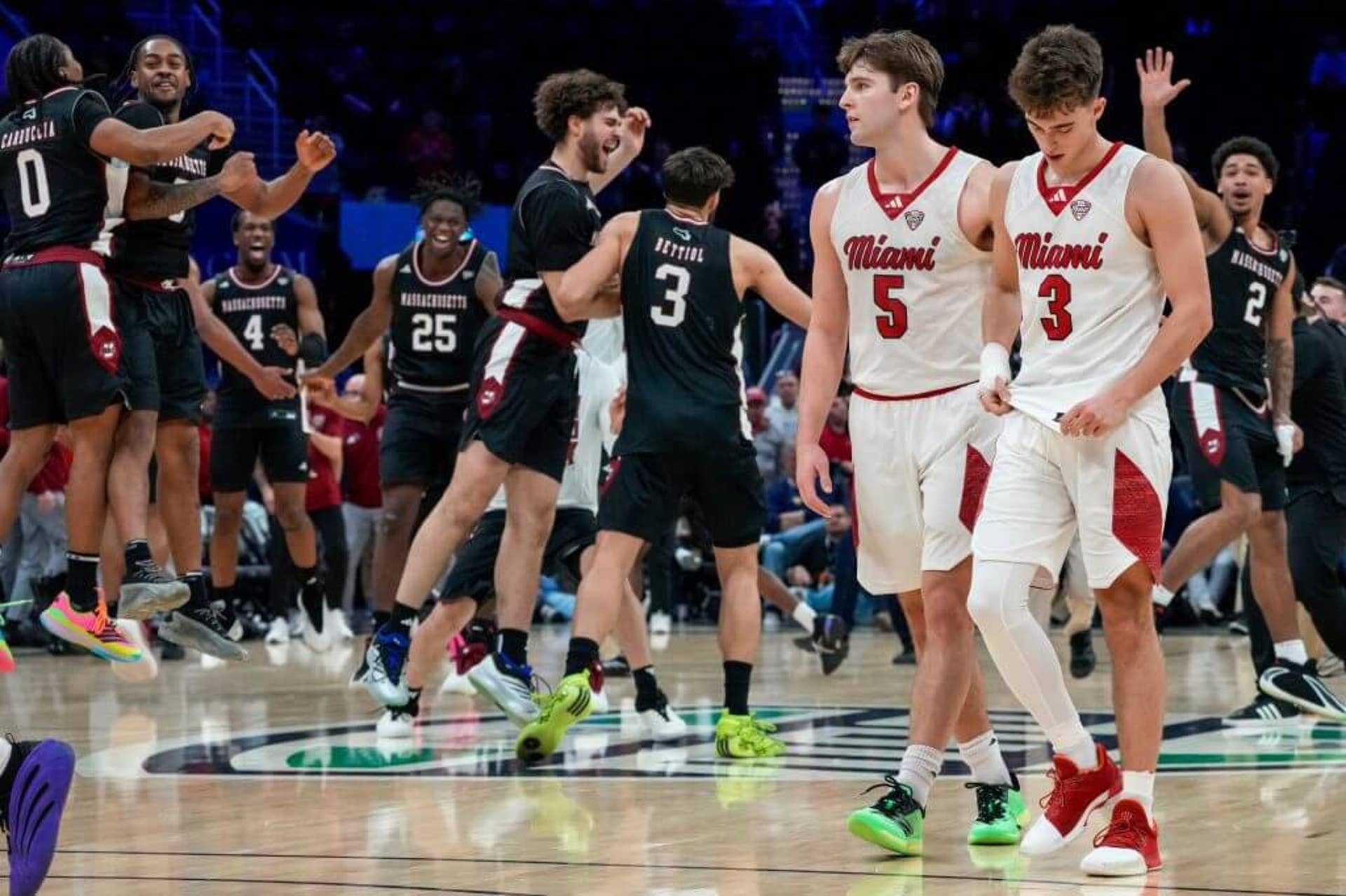 Miami Redhawks guards Peter Suder and Luke Skaljac walk off the floor after Thursday's loss.