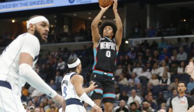 Memphis Grizzlies wing Jaylen Wells shoots 3-pointer against Dallas Mavericks defenders