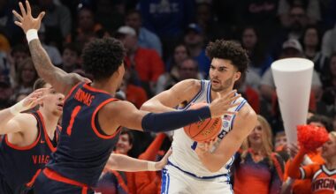 Mar 14, 2026; Charlotte, NC, USA; Duke Blue Devils forward Cameron Boozer (12) defends as Virginia Cavaliers guard Malik Thomas (1) defends in the first half during the men's ACC Conference Tournament Championship at Spectrum Center.