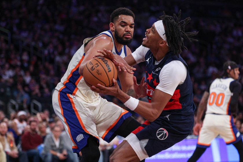 Mar 22, 2026; New York, New York, USA; Washington Wizards guard Bilal Coulibaly (0) is fouled by New York Knicks center Karl-Anthony Towns (32) during the second half at Madison Square Garden.