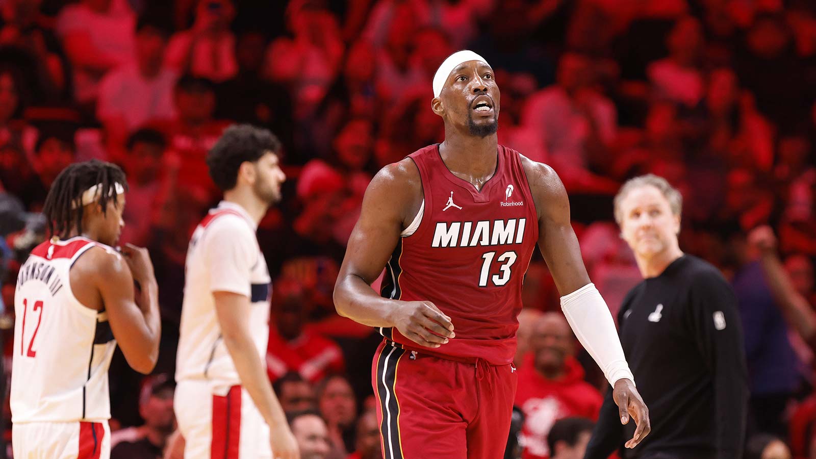 Miami Heat center Bam Adebayo (13) walks back to the bench during a time out against the Washington Wizards during the second half at Kaseya Center.