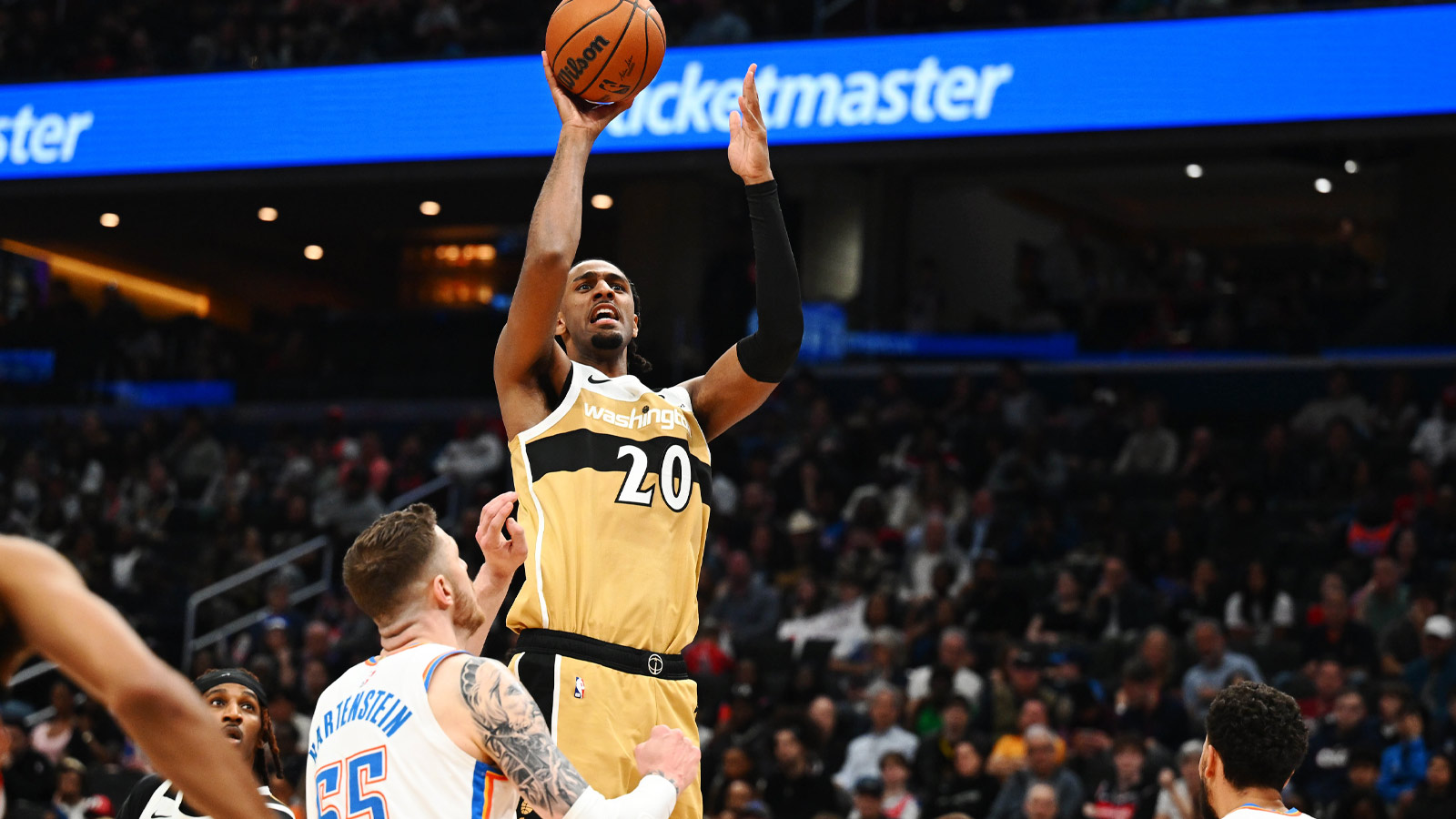 Wizards center Alex Sarr (20) shoots over Oklahoma City Thunder center/forward Isaiah Hartenstein (55) during the first half at Capital One Arena