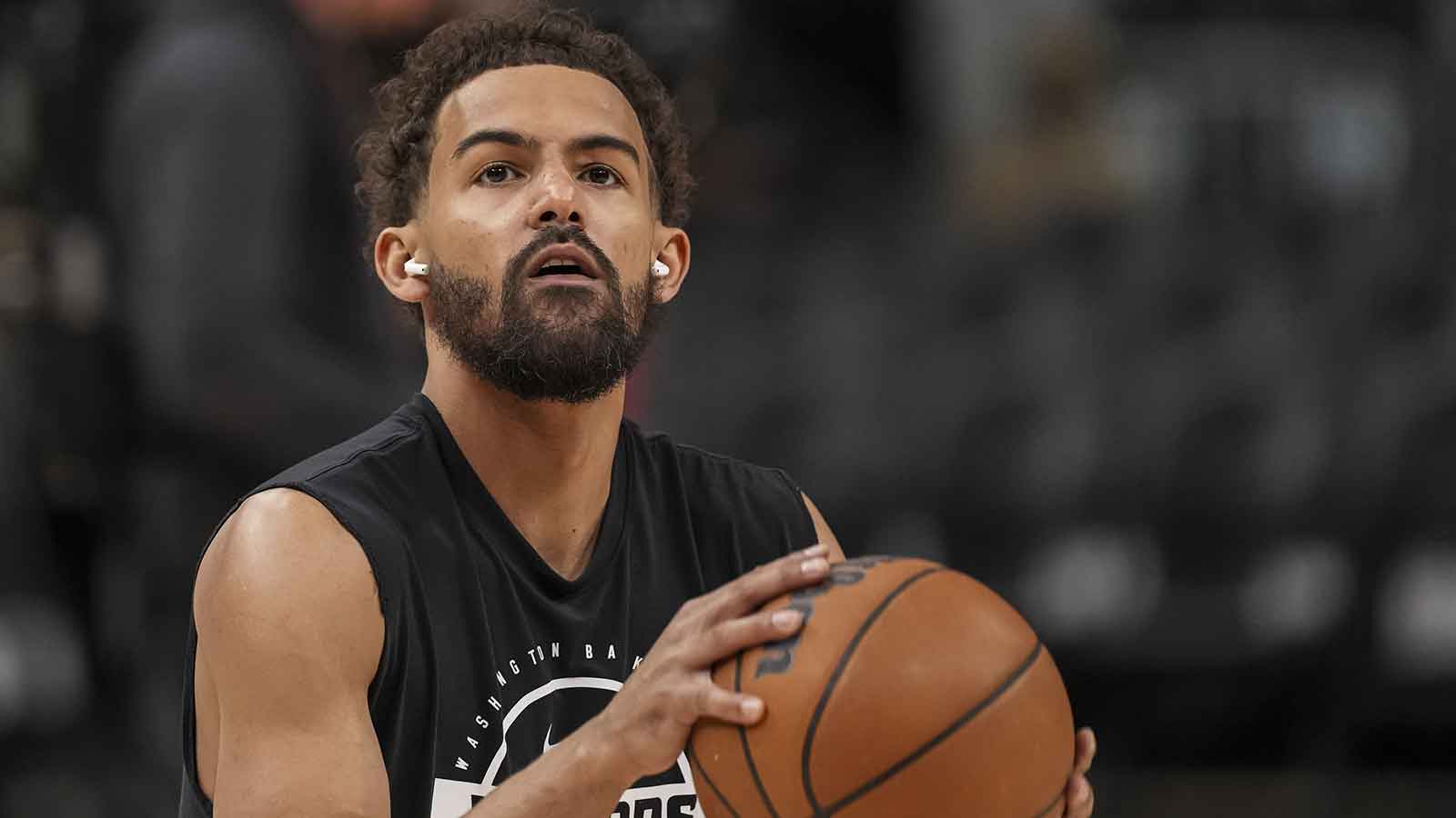 Wizards guard Trae Young (3) warms up on the court before the game against the Atlanta Hawks at State Farm Arena