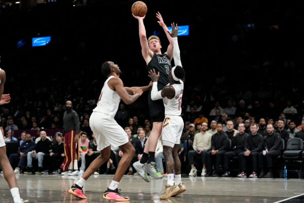 Brooklyn Nets forward Danny Wolf (2) shoots over Cleveland Cavaliers guard Dennis Schroder (8) during the first half of an NBA basketball game, Sunday, March 1, 2026, in New York. (AP Photo/Yuki Iwamura)