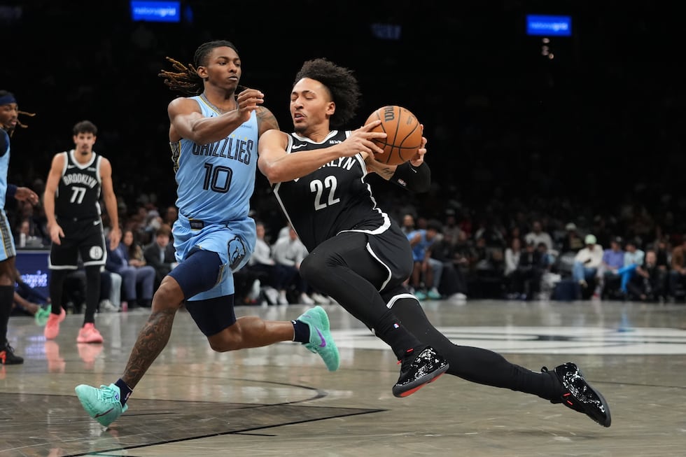Memphis Grizzlies' Javon Small (10) defends Brooklyn Nets' Jalen Wilson (22) during the first...