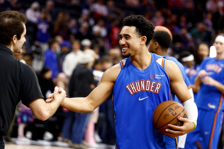 Oklahoma City Thunder guard Jared McCain warms up before the game.