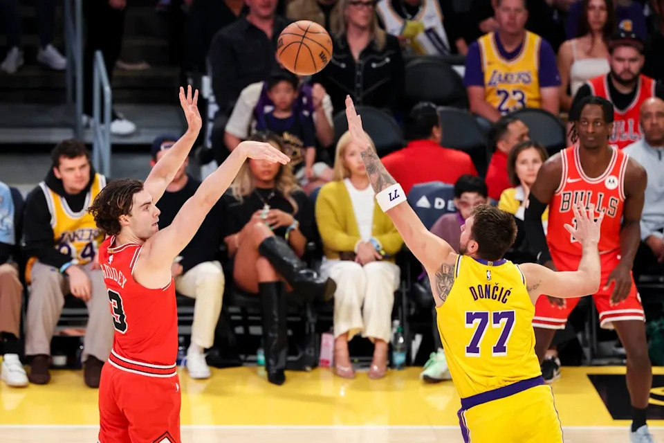 Josh Giddey #3 of the Chicago Bulls shoots the ball over Luka Dončić #77 of the Los Angeles Lakers during an NBA basketball game, Thursday March 12, 2026 in Los Angeles, Calif.