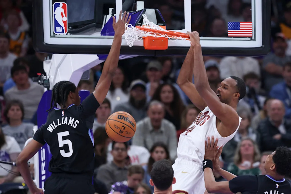 Cleveland Cavaliers center Evan Mobley (4) dunks the ball as Utah Jazz forward Cody Williams (5) defends March 30, 2026, in Salt Lake City, Utah.