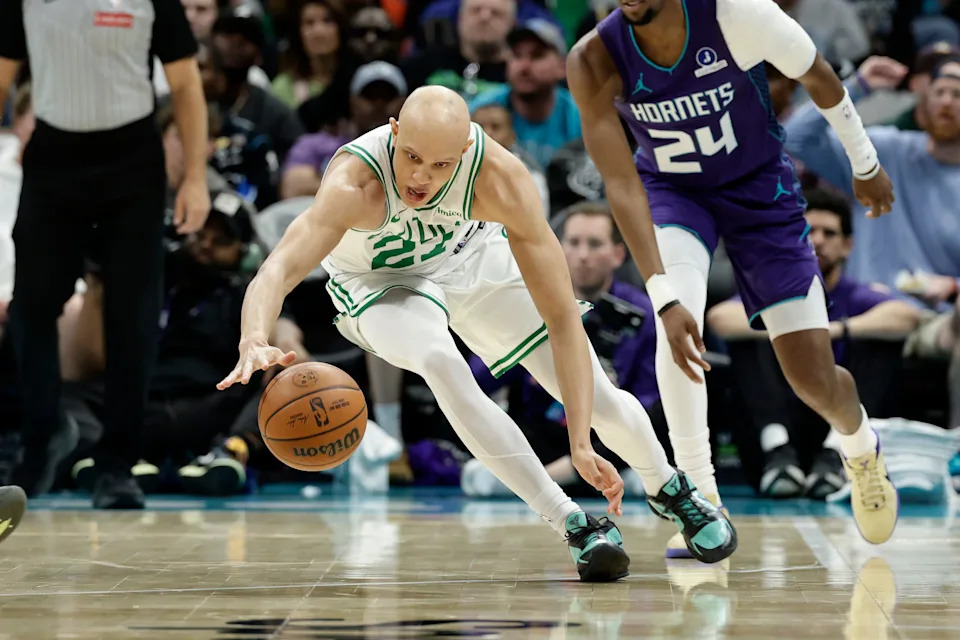 Mar 29, 2026; Charlotte, North Carolina, USA; Boston Celtics guard Jordan Walsh (27) dives after a loose ball during the second quarter against the Charlotte Hornets at Spectrum Center. Mandatory Credit: Brian Westerholt-Imagn Images