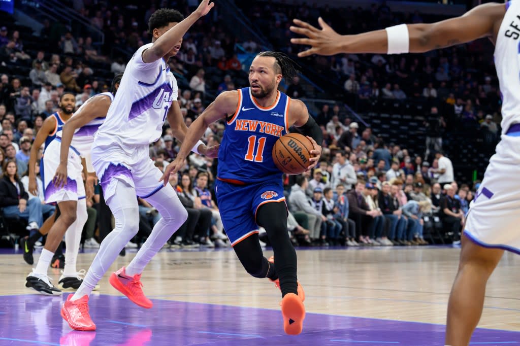 Knicks guard Jalen Brunson, center, drives to the basket guarded by Utah Jazz guard Ace Bailey, center left, during the first half of an NBA basketball game, Wednesday, March 11, 2026. AP