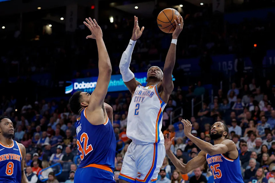 Mar 29, 2026; Oklahoma City, Oklahoma, USA; Oklahoma City Thunder guard Shai Gilgeous-Alexander (2) shoots as New York Knicks center Karl-Anthony Towns (32) defends during the second half at Paycom Center. Mandatory Credit: Alonzo Adams-Imagn Images