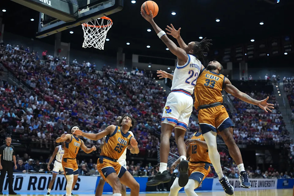 March 20, 2026; San Diego, CA; Kansas basketball guard Darryn Peterson (22) shoots against California Baptist guard Martel Williams (33) during a men's 2026 NCAA Tournament game at Viejas Arena.