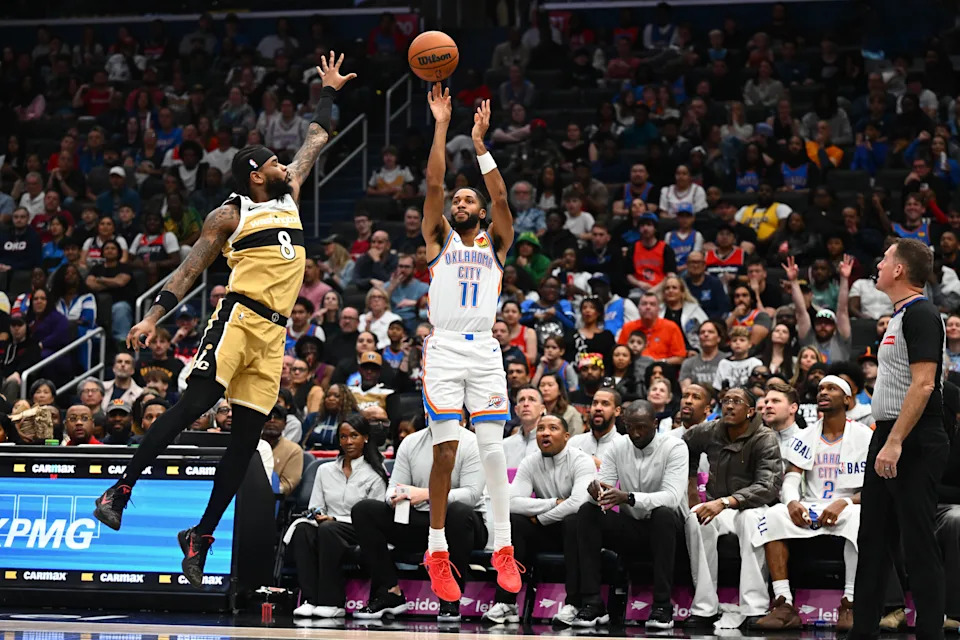 Mar 21, 2026; Washington, District of Columbia, USA; Oklahoma City Thunder guard Isaiah Joe (11) shoots over Washington Wizards guard Jaden Hardy (8) during the second half at Capital One Arena. Mandatory Credit: Brad Mills-Imagn Images