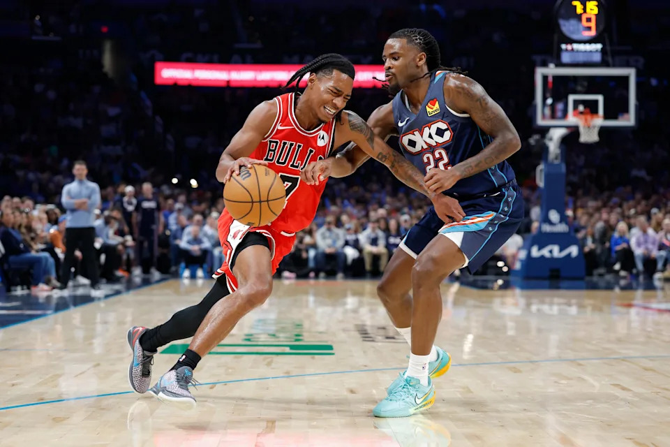 Mar 27, 2026; Oklahoma City, Oklahoma, USA; Chicago Bulls guard Rob Dillingham (7) drives down the court as Oklahoma City Thunder guard Cason Wallace (22) defends during the second half at Paycom Center. Mandatory Credit: Alonzo Adams-Imagn Images