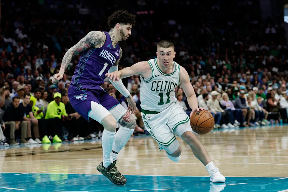 Mar 29, 2026; Charlotte, North Carolina, USA; Boston Celtics guard Payton Pritchard (11) drives past Charlotte Hornets guard LaMelo Ball (1) during the second quarter at Spectrum Center. Mandatory Credit: Brian Westerholt-Imagn Images