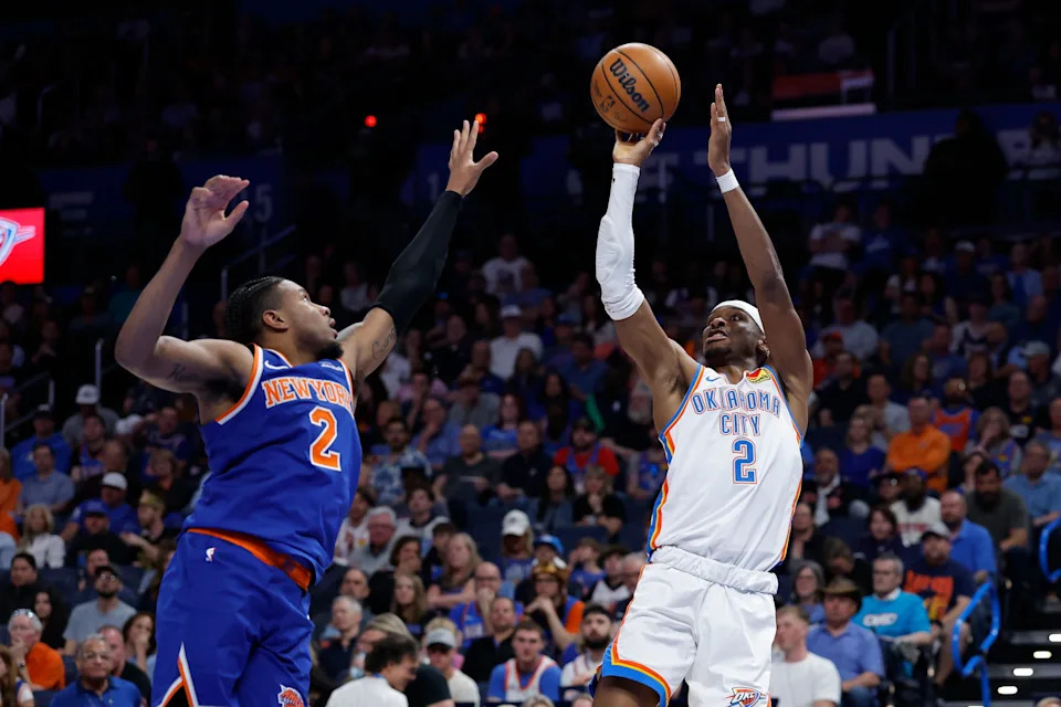 Mar 29, 2026; Oklahoma City, Oklahoma, USA; Oklahoma City Thunder guard Shai Gilgeous-Alexander (2) shoots as New York Knicks guard Miles McBride (2) defends during the second half at Paycom Center. Mandatory Credit: Alonzo Adams-Imagn Images