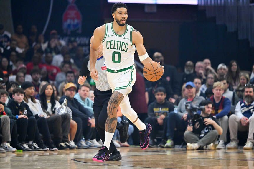 Jayson Tatum of the Boston Celtics brings the ball up court during the first quarter against the Cleveland Cavaliers.