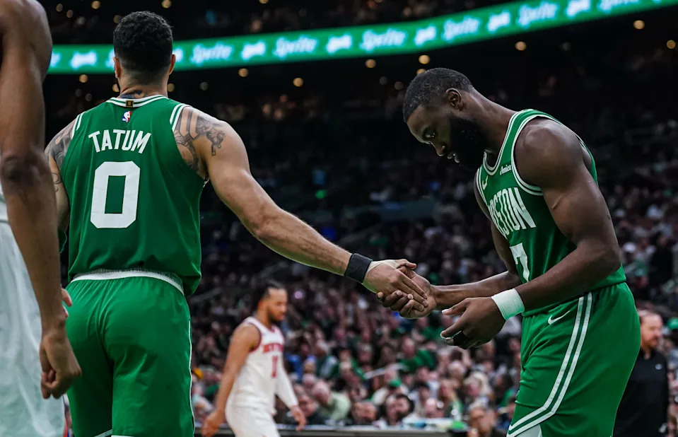 May 7, 2025; Boston, Massachusetts, USA; Boston Celtics guard Jaylen Brown (7) reacts after missing a pass from Boston Celtics forward Jayson Tatum (0) against the New York Knicks in the second half during game two of the second round for the 2025 NBA Playoffs at TD Garden. Mandatory Credit: David Butler II-Imagn Images