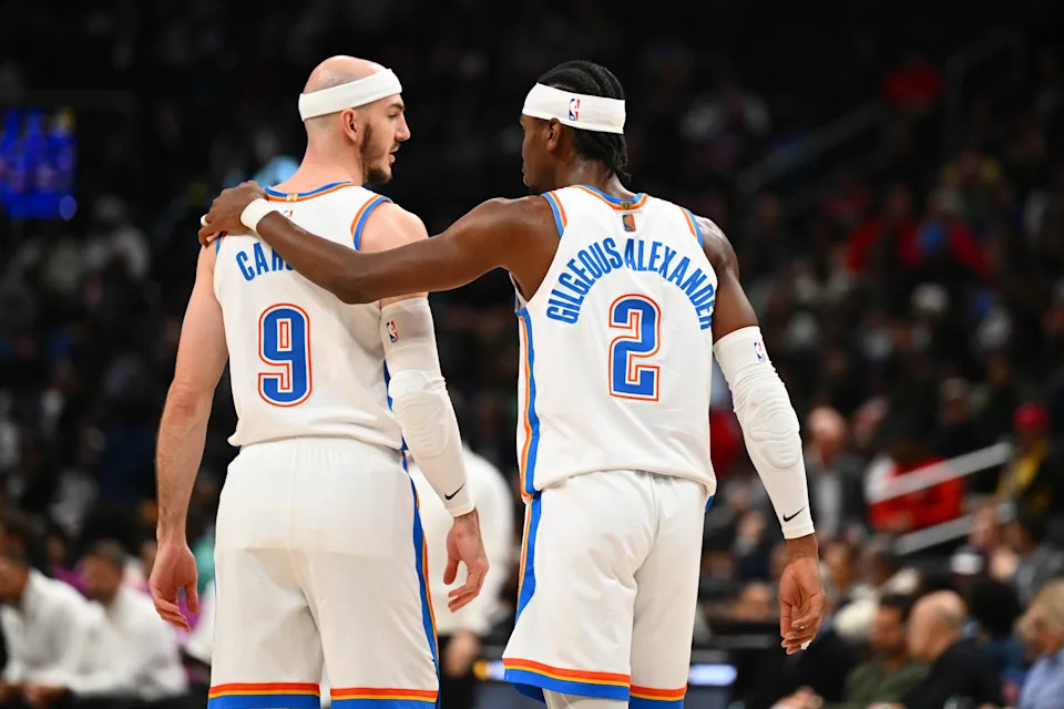 Mar 21, 2026; Washington, District of Columbia, USA; Oklahoma City Thunder guard Shai Gilgeous-Alexander (2) talks with guard Alex Caruso (9) against the Washington Wizards during the first half at Capital One Arena. Mandatory Credit: Brad Mills-Imagn Images
