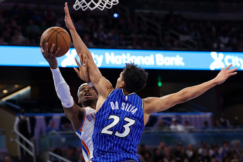 Mar 17, 2026; Orlando, Florida, USA; Oklahoma City Thunder guard Shai Gilgeous-Alexander (2) drives to the basket past Orlando Magic forward Tristan da Silva (23) in the third quarter at Kia Center. Mandatory Credit: Nathan Ray Seebeck-Imagn Images