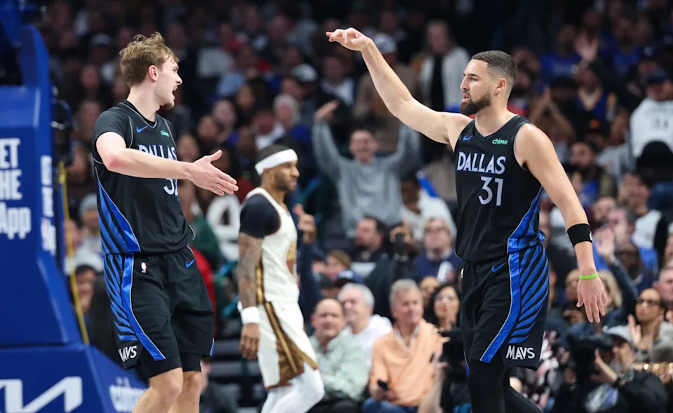 Dallas Mavericks forward Cooper Flagg (32) celebrates with guard Klay Thompson (31)Kevin Jairaj-Imagn Images