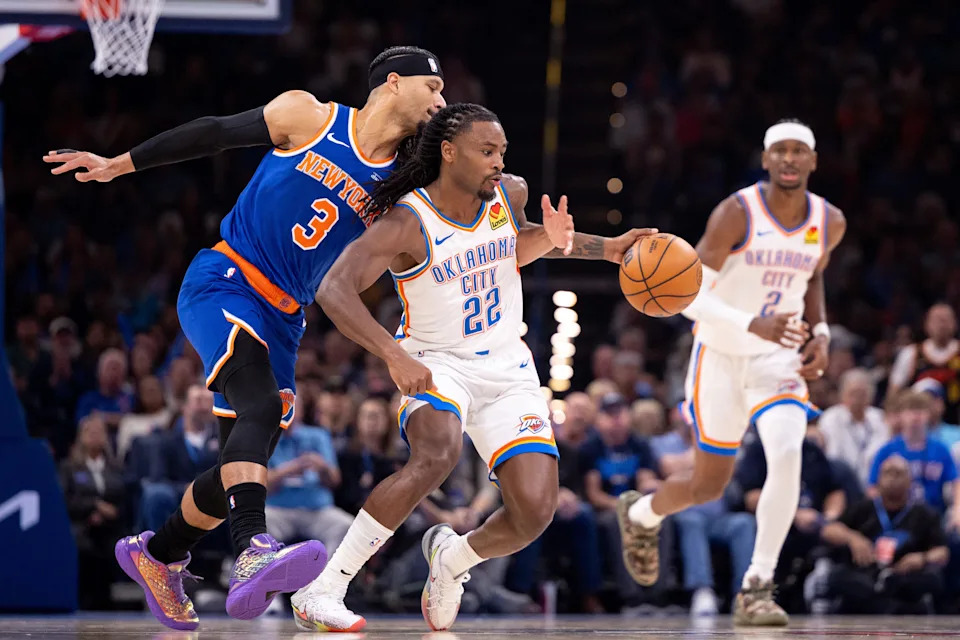 OKLAHOMA CITY, OKLAHOMA - MARCH 29: Cason Wallace #22 of the Oklahoma City Thunder brings the ball up court around Josh Hart #3 of the New York Knicks during the first half at Paycom Center on March 29, 2026 in Oklahoma City, Oklahoma. NOTE TO USER: User expressly acknowledges and agrees that, by downloading and or using this photograph, User is consenting to the terms and conditions of the Getty Images License Agreement. (Photo by William Purnell/Getty Images)