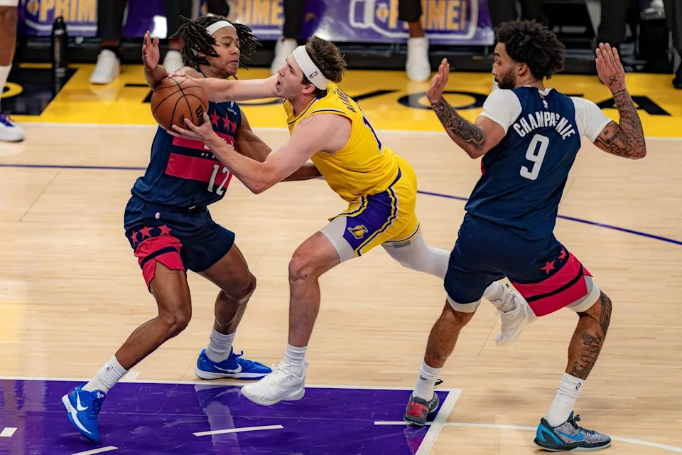 Los Angeles Lakers guard Austin Reaves(15) being fouled during an NBA basketball game against the Washington Wizards on March 30th, 2026 in Los Angeles, CA.