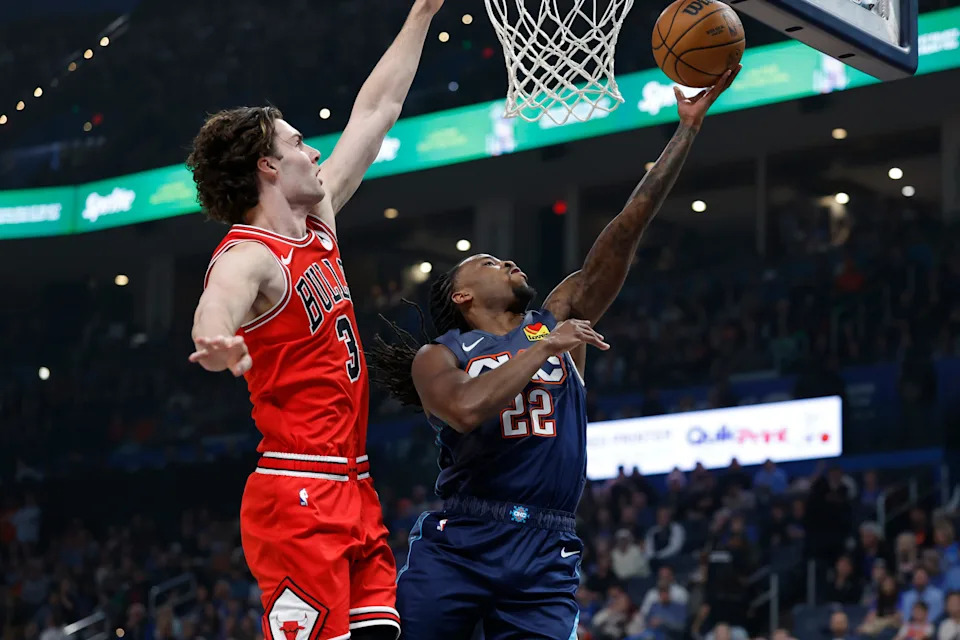 Mar 27, 2026; Oklahoma City, Oklahoma, USA; Oklahoma City Thunder guard Cason Wallace (22) goes up for a basket beside Chicago Bulls guard Josh Giddey (3) during the first quarter at Paycom Center. Mandatory Credit: Alonzo Adams-Imagn Images