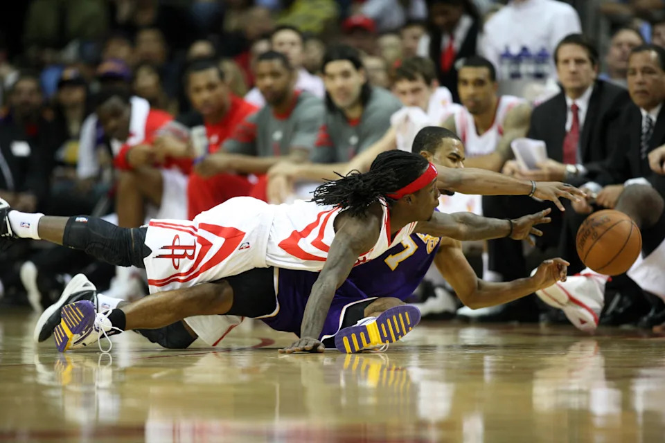 Mar 20, 2012; Houston, TX, USA; Houston Rockets guard Courtney Fortson (9) and Los Angeles Lakers guard Ramon Sessions (7) chase a loose ball in the third quarter at the Toyota Center. The Rockets defeated the Lakers 107-104. Mandatory Credit: Brett Davis-USA TODAY Sports