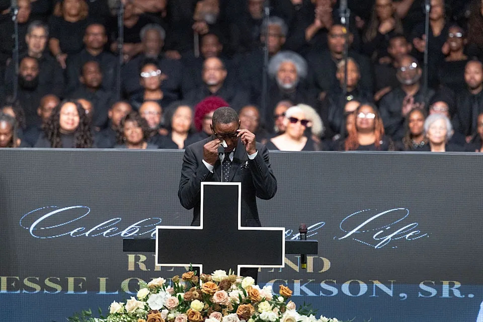 Pistons great Isiah Thomas wipes a tear as he speaks at the funeral for Jesse Jackson in Chicago on Friday.