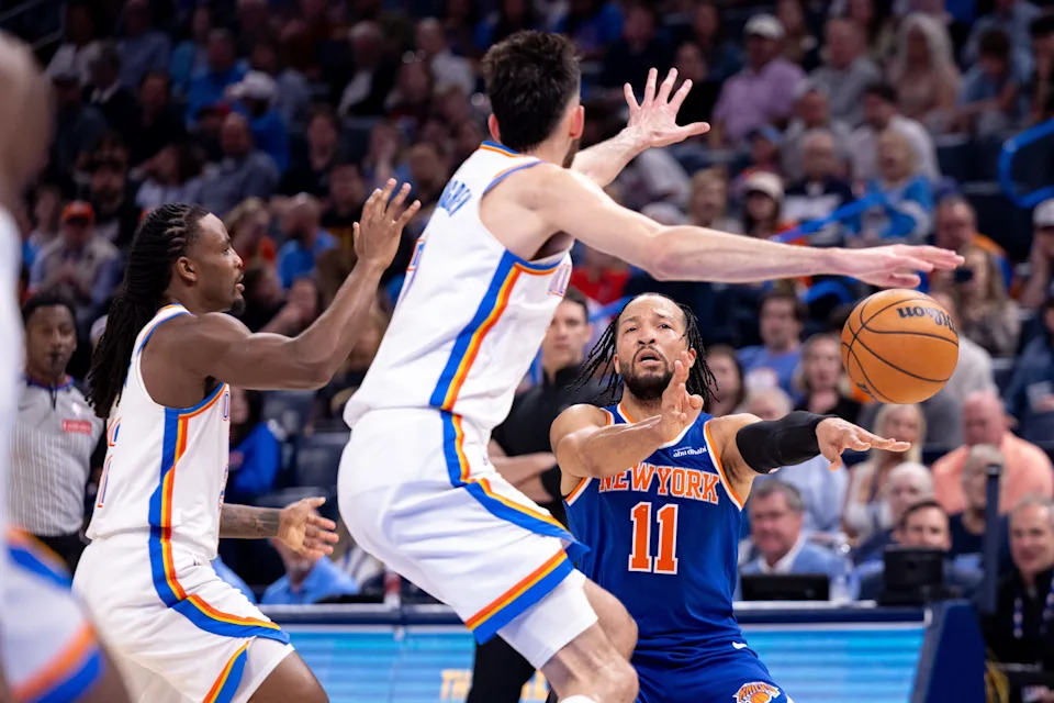 OKLAHOMA CITY, OKLAHOMA - MARCH 29: Jalen Brunson #11 of the New York Knicks passes the ball around Chet Holmgren #7 of the Oklahoma City Thunder during the second half at Paycom Center on March 29, 2026 in Oklahoma City, Oklahoma. NOTE TO USER: User expressly acknowledges and agrees that, by downloading and or using this photograph, User is consenting to the terms and conditions of the Getty Images License Agreement. (Photo by William Purnell/Getty Images)