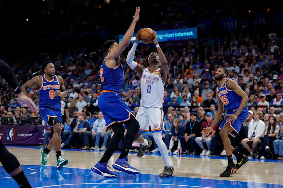 Mar 29, 2026; Oklahoma City, Oklahoma, USA; Oklahoma City Thunder guard Shai Gilgeous-Alexander (2) shoots as New York Knicks center Karl-Anthony Towns (32) defends during the second half at Paycom Center. Mandatory Credit: Alonzo Adams-Imagn Images