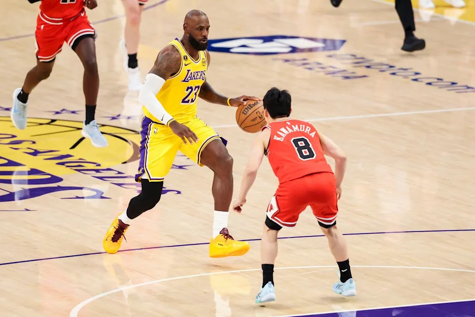 LeBron James #23 of the Los Angeles Lakers drives towards the rim as Yuki Kawamura #8 of the Chicago Bulls steps in front to defend during an NBA basketball game, Thursday March 12, 2026 in Los Angeles, Calif.