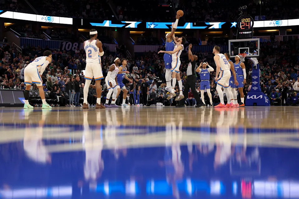 Mar 17, 2026; Orlando, Florida, USA; Orlando Magic center Wendell Carter Jr. (34) and Oklahoma City Thunder center Chet Holmgren (7) tip off at Kia Center. Mandatory Credit: Nathan Ray Seebeck-Imagn Images