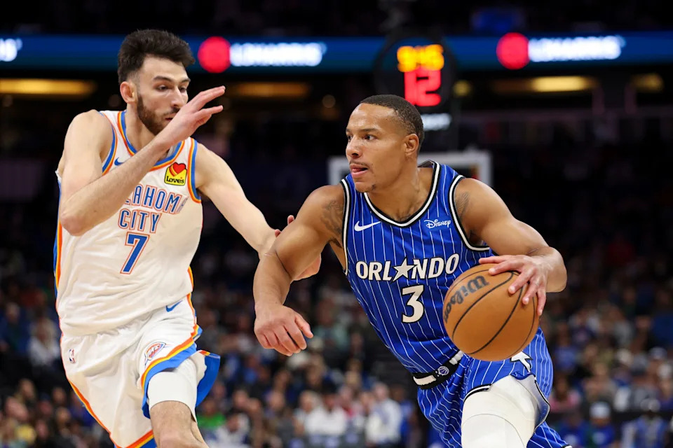Mar 17, 2026; Orlando, Florida, USA; Orlando Magic guard Desmond Bane (3) drives to the basket past Oklahoma City Thunder center Chet Holmgren (7) in the first quarter at Kia Center. Mandatory Credit: Nathan Ray Seebeck-Imagn Images