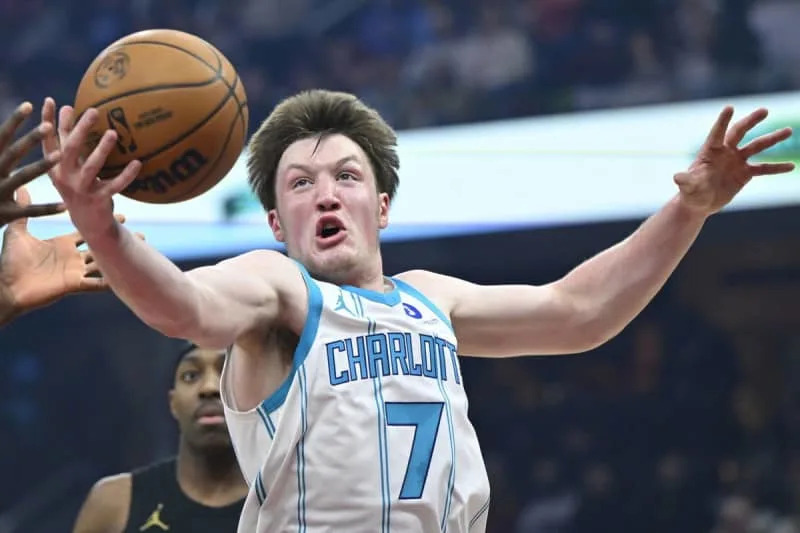 Dec 14, 2025; Cleveland, Ohio, USA; Charlotte Hornets guard Kon Knueppel (7) rebounds in the first quarter against the Cleveland Cavaliers at Rocket Arena. Mandatory Credit: David Richard-Imagn Images