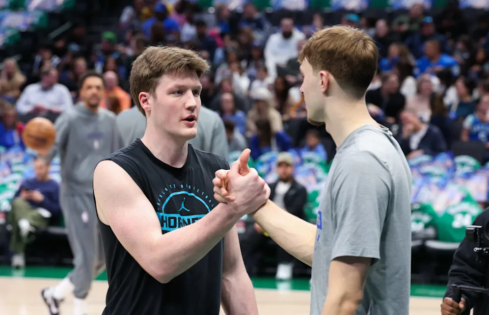 Jan 29, 2026; Dallas, Texas, USA; Dallas Mavericks forward Cooper Flagg (right) speaks with Charlotte Hornets guard Kon Knueppel (left) before the game at American Airlines Center. Mandatory Credit: Kevin Jairaj-Imagn Images