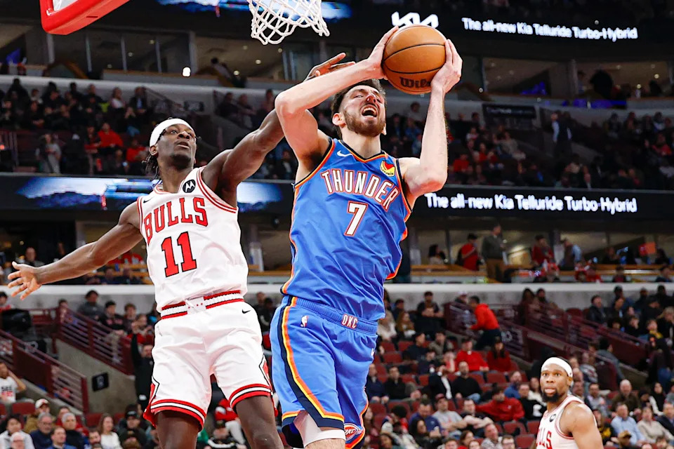 Mar 3, 2026; Chicago, Illinois, USA; Chicago Bulls forward Leonard Miller (11) defends against Oklahoma City Thunder center Chet Holmgren (7) during the second half at United Center. Mandatory Credit: Kamil Krzaczynski-Imagn Images
