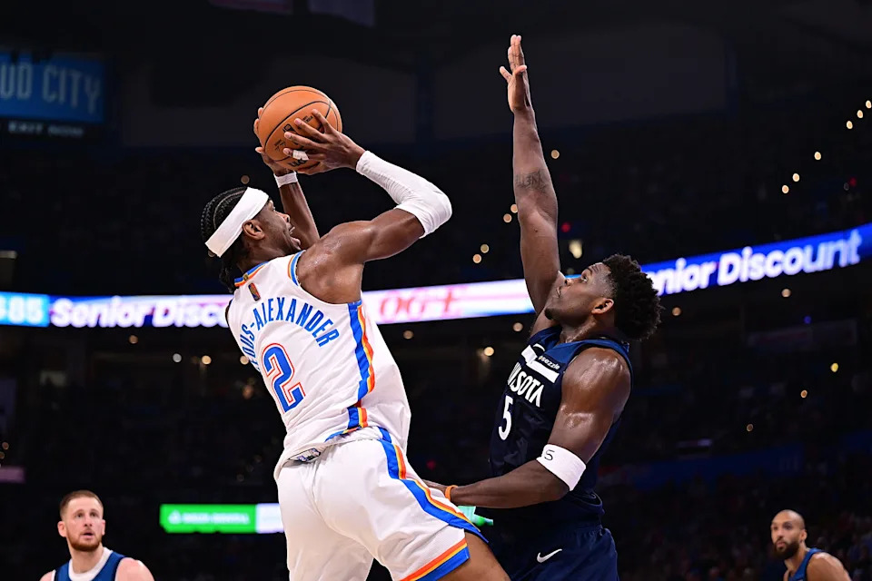 OKLAHOMA CITY, OKLAHOMA - MARCH 15: Shai Gilgeous-Alexander #2 of the Oklahoma City Thunder attempts a shot in front of Anthony Edwards #5 of the Minnesota Timberwolves during the second half at Paycom Center on March 15, 2026 in Oklahoma City, Oklahoma. NOTE TO USER: User expressly acknowledges and agrees that, by downloading and or using this photograph, User is consenting to the terms and conditions of the Getty Images License Agreement. (Photo by Joshua Gateley/Getty Images)
