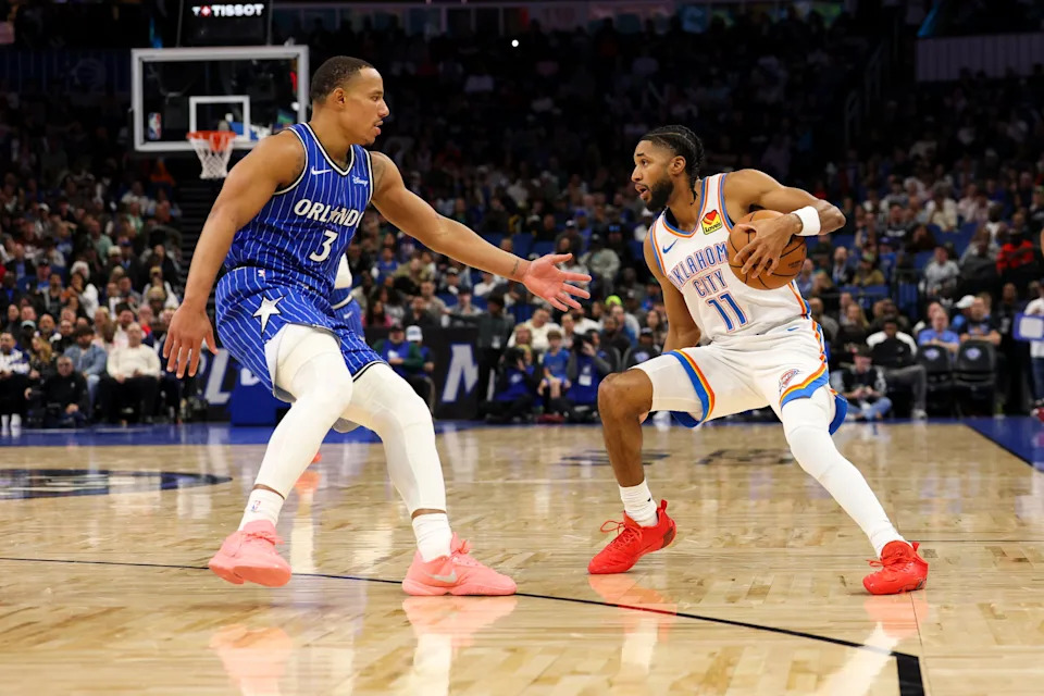 Mar 17, 2026; Orlando, Florida, USA; Oklahoma City Thunder guard Isaiah Joe (11) is guarded by Orlando Magic guard Desmond Bane (3) in the fourth quarter at Kia Center. Mandatory Credit: Nathan Ray Seebeck-Imagn Images