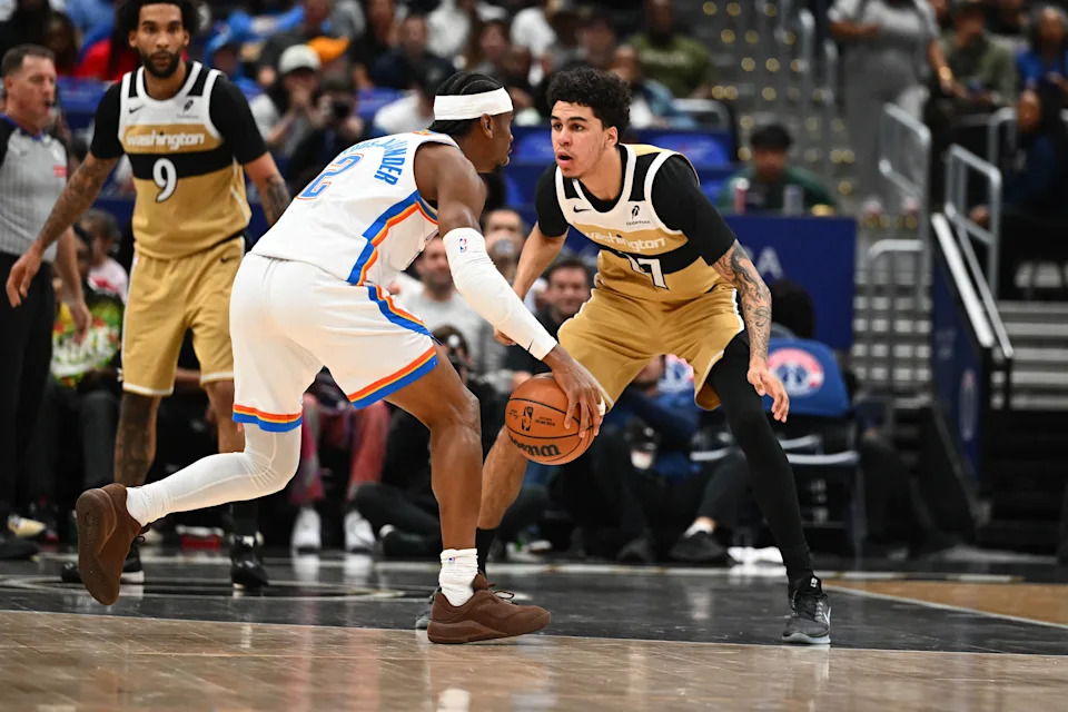Mar 21, 2026; Washington, District of Columbia, USA; Washington Wizards forward Will Riley (27) defends Oklahoma City Thunder guard Shai Gilgeous-Alexander (2) during the first half at Capital One Arena. Mandatory Credit: Brad Mills-Imagn Images