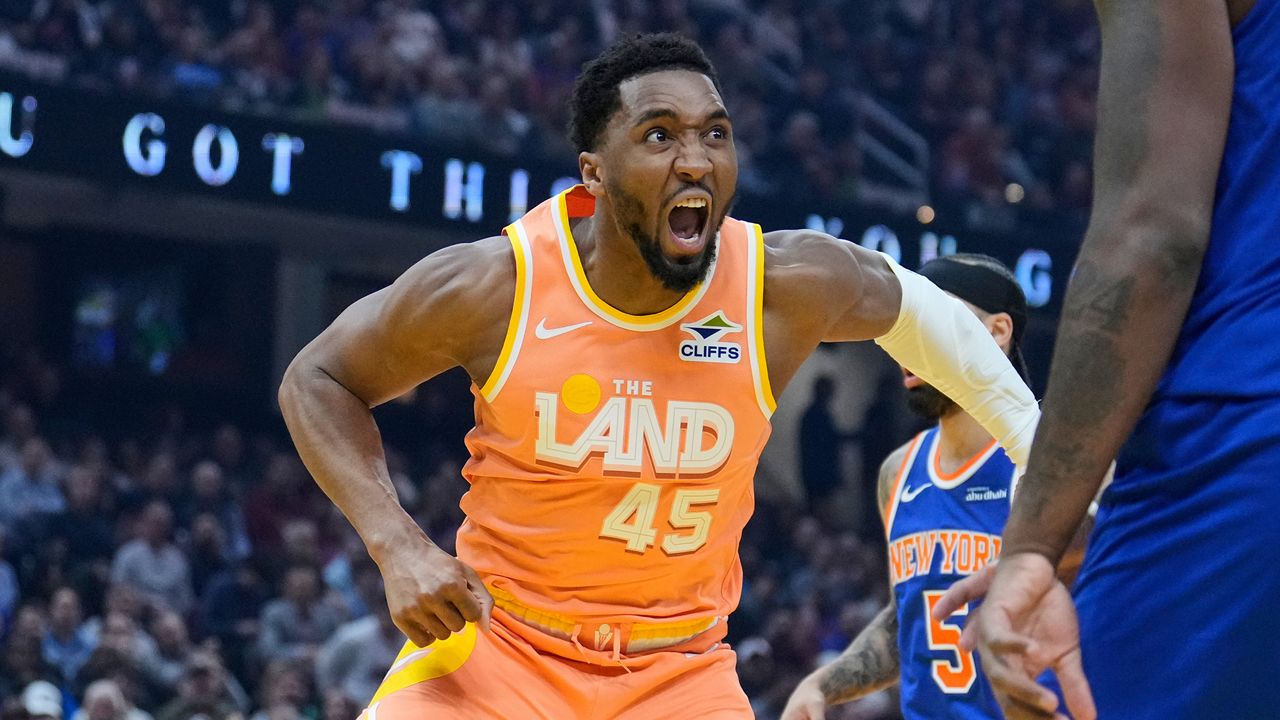 Cleveland Cavaliers guard Donovan Mitchell (45) reacts after dunking in the first half of an NBA basketball game against the New York Knicks in Cleveland, Tuesday, Feb. 24, 2026. (AP Photo/Sue Ogrocki)