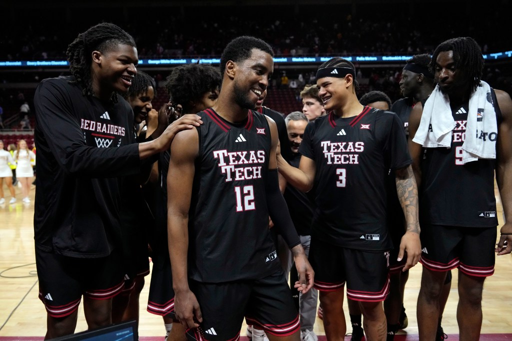Texas Tech forward Donovan Atwell (12) celebrates with teammates after an NCAA college basketball game against Iowa State, Saturday, Feb. 28, 2026, in Ames, Iowa.