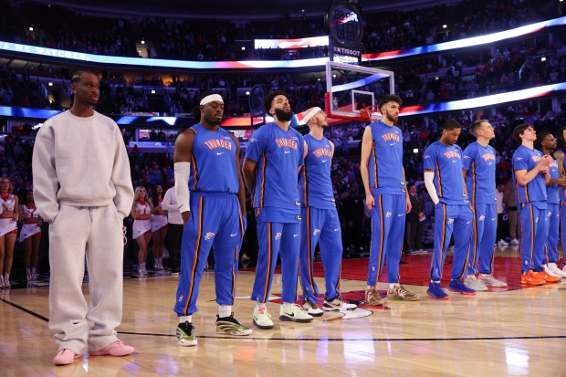 Oklahoma City Thunder players stand on the court for the national anthem before playing the Chicago Bulls at the United Center March 3, 2026 in Chicago. (Armando L. Sanchez/Chicago Tribune)