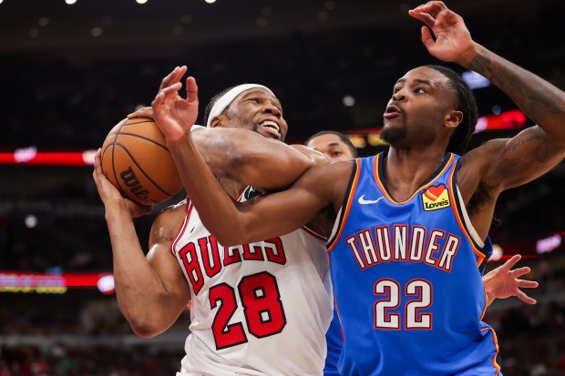 Chicago Bulls forward Guerschon Yabusele (28) grabs a rebound past Oklahoma City Thunder guard Cason Wallace (22) during the first quarter at the United Center March 3, 2026 in Chicago. (Armando L. Sanchez/Chicago Tribune)